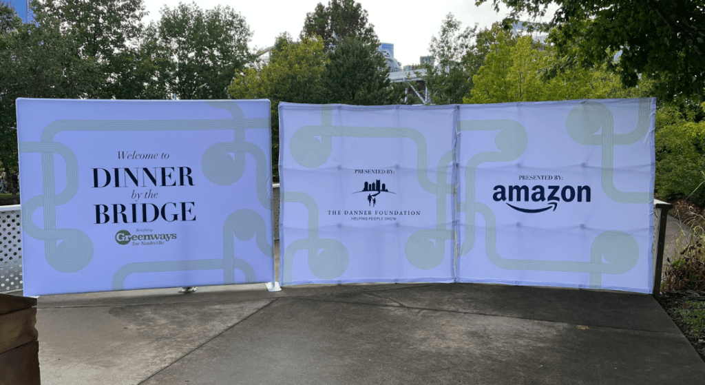 Event Signs of Amazon, Dinner by Bridge and the Danner Foundation