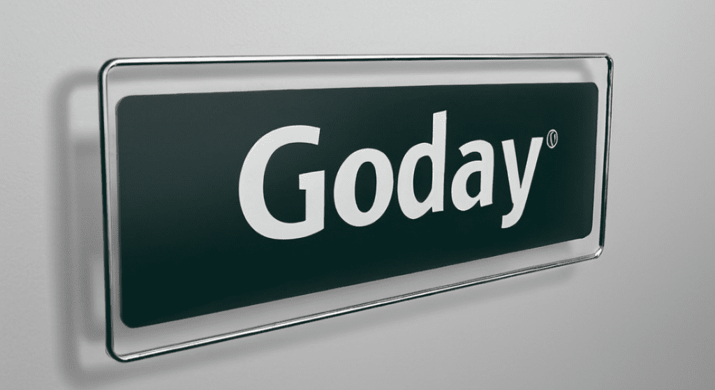 A rectangular sign with a dark green background and the word "Goday" in white letters, mounted on a wall with a metallic frame Lobby Signs: Design Tips, Types, and Benefits