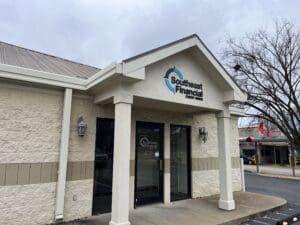 Exterior view of a Southeast Financial Credit Union branch building with a glass door and company logo above the entrance.
